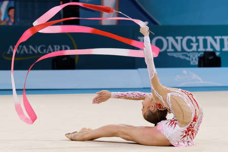 Kiev, Ukraine - August 29, 2013: Unidentified female gymnast performs with ribbon during 32nd Rhythmic Gymnastics World Championships. The event is held in Palace of Sportのeditorial素材