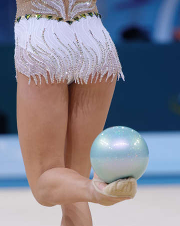Kiev, Ukraine - August 30, 2013: Unidentified female gymnast performs with clubs during 32nd Rhythmic Gymnastics World Championships. The event is held in Palace of Sportのeditorial素材