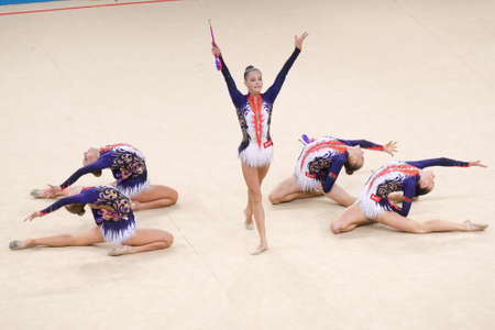 Kiev, Ukraine - September 1, 2013: Team Belarus performs with clubs during 32nd Rhythmic Gymnastics World Championships. The event is held in the Palace of Sportsのeditorial素材