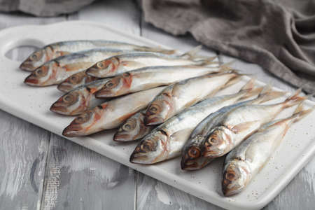 Chicharros, raw Atlantic horse mackerel on a cutting boardの写真素材