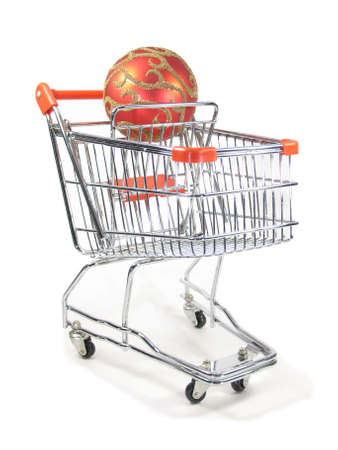 A christmas ornament in a miniature shopping cart.の写真素材