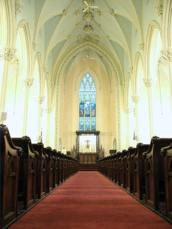 View of the altar past the pews down the aisle.の写真素材