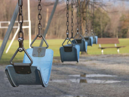 Empty swingset in a park.の写真素材