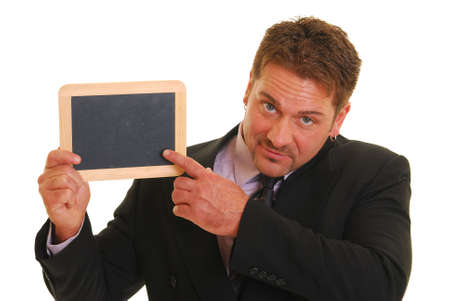 Man in a suit with a blank chalkboard isolated on whiteの写真素材
