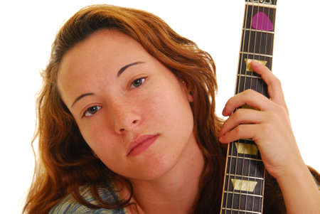 Attractive young woman holding a guitar