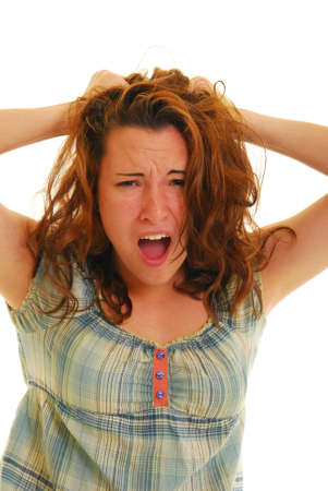 Attractive woman stressed out with hands in her hair