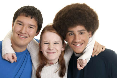 Three teens of different ethnic backgrounds smilingの写真素材