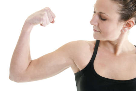 Attractive, fit Caucasian woman flexes her muscleの写真素材