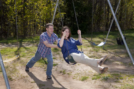 Happy Caucasian couple enjoys a beautiful day at the parkの写真素材