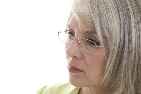 Mature, attractive Caucasian woman with a serious expression on her face.の写真素材