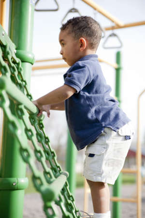 Cute multi-racial boy at the park playingの写真素材