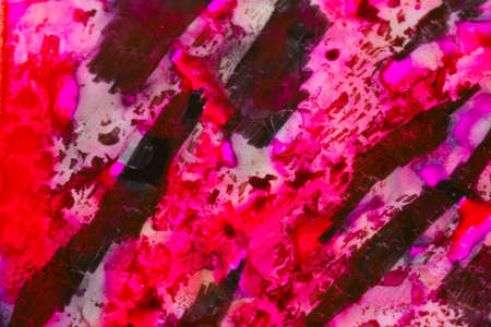 Handmade watercolor with red, black and pink. Useable as a background or texture.の写真素材