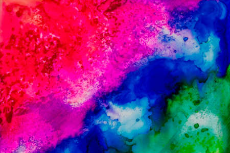 Handmade watercolor with red, purple, blue and green. Useable as a background or texture.の写真素材