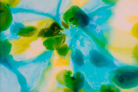 Handmade watercolor with blue, yellow and green. Spring colors. Useable as a background or texture.の写真素材