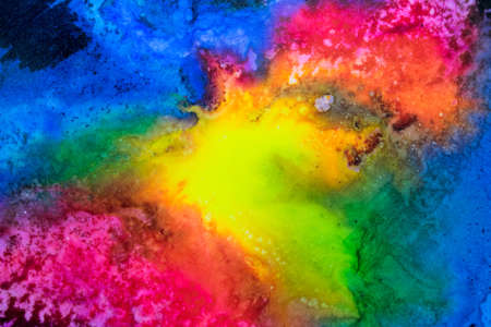 Handmade watercolor with rainbow galaxy splatter. Useable as a background or texture.の写真素材