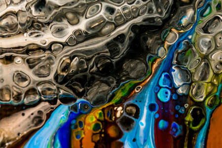 Handmade modern abstract painting. Made with fluid acrylic paints, by acrylic pouring with silicone and torching. Useable as a background or texture.の写真素材