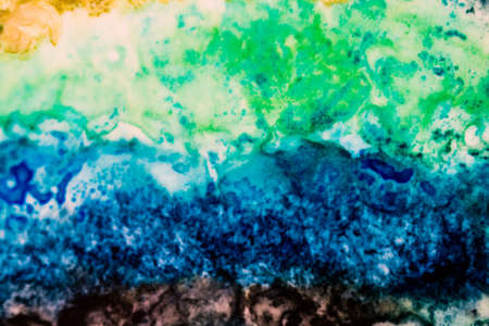 Handmade modern abstract painting. Made with alcohol inks, by using watercolor techniques and rubbing alcohol. Useable as a background or texture.の写真素材