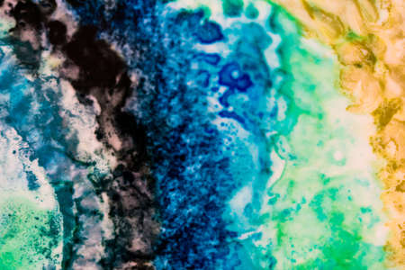 Handmade modern abstract painting. Made with alcohol inks, by using watercolor techniques and rubbing alcohol. Useable as a background or texture.の写真素材