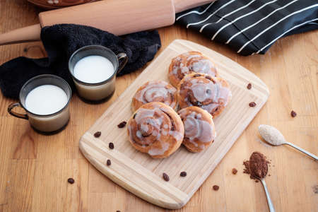 Spiral cinnamon buns on the tableの写真素材
