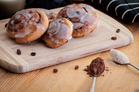 Spiral cinnamon buns on the tableの写真素材