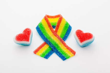 Rainbow ribbon with two hearts made of candy の写真素材