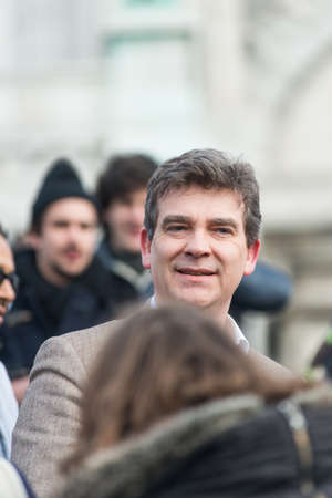 French Minister for Industrial Renewal Arnaud Montebourg supports the made in France and talks to the  employees of the company Blanc de Vosges at Montmartre.Paris, FRANCE-06/04/2013のeditorial素材