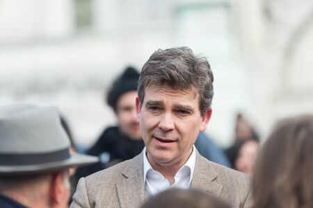 French Minister for Industrial Renewal Arnaud Montebourg supports the made in France and talks to the  employees of the company Blanc de Vosges at Montmartre.Paris, FRANCE-06/04/2013のeditorial素材