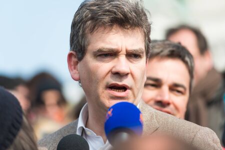 French Minister for Industrial Renewal Arnaud Montebourg supports the made in France and is interviewed at Montmartre. Paris, FRANCE-06/04/2013のeditorial素材