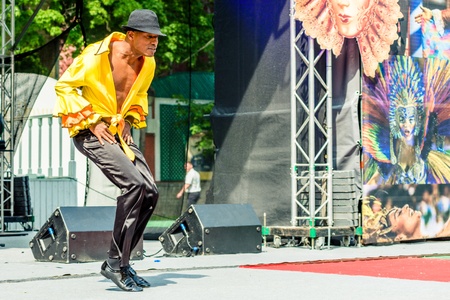 MOSCOW, RUSSIA - 18 MAY: Participants of annual carnival in Moscow in Ermitage Garden - latin dancer...