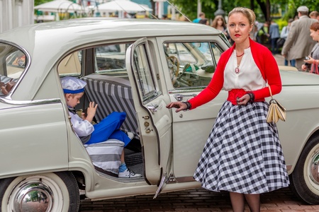 MOSCOW, RUSSIA - Retro festival 'Days of history' in Hermitage Garden. Woman in retro style and old...