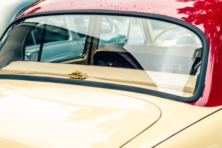 MOSCOW, RUSSIA - Retro festival 'Days of history' in Hermitage Garden. Back window of 'Volga' and model of the old soviet police car. Moscow, May 26, 2013のeditorial素材