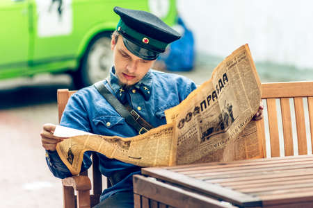 MOSCOW, RUSSIA - Retro festival 'Days of history' in Hermitage Garden. Red Army soldier reading...