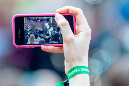 MOSCOW, RUSSIA - 1 JUNE: Citizens! band on smartphone screen on Moscow Ahmad Tea Music Festival. Moscow, 1 June, 2013のeditorial素材