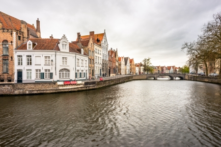Canal, street and houses in Bruges, Belgiumの写真素材