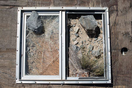 Broken window on the sand