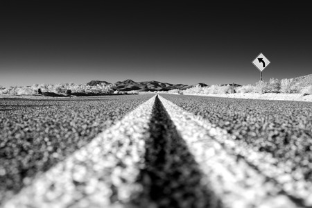 Road in the desert and turn signの写真素材
