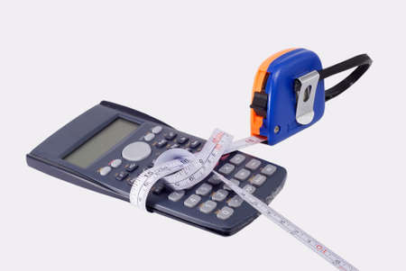 It's a disorder sight, measure tape tied computer so close.の写真素材