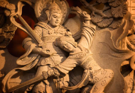 It is a stong carving of Taiwan. Maybe had one long story and fable.の写真素材