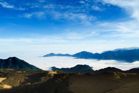 Clouds like sea and waterfall in high mountain.の写真素材