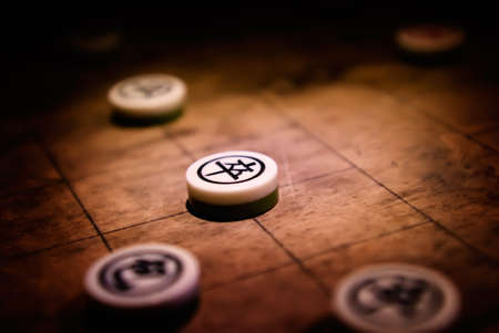 Chinese chess with weak light in the night.の写真素材