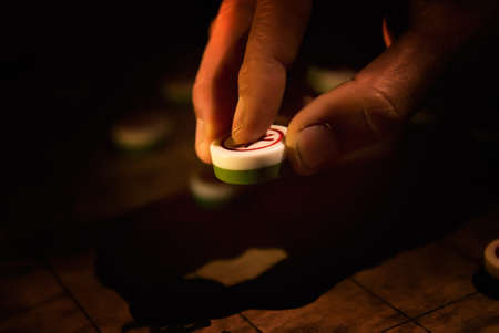 Chinese chess with weak light in the night.