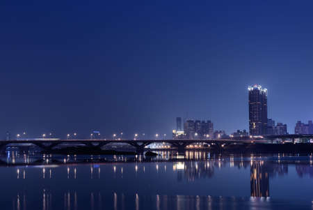 It is a lonely blue and purple city night.の写真素材