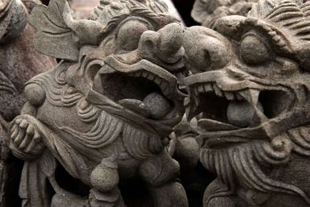 It is a traditional chinese carving of lion,just talk to each other.の写真素材