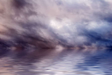 There are beautiful clouds over the water.の写真素材