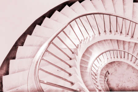 It is the beautiful spiraling stairs with colors.の写真素材