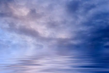 There are beautiful clouds over the water.の写真素材