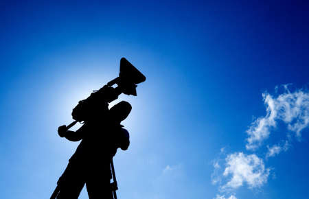 Here is a cameraman with silhouette photo.の写真素材