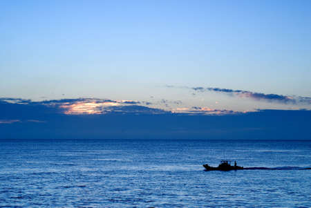 There is a boat in the ocean.の写真素材