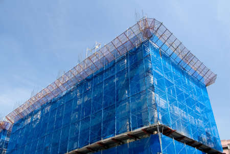 It is a blue building that under construction.の写真素材