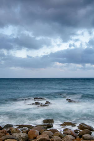 It is landscape of rock coast and beautifful cloud.の写真素材